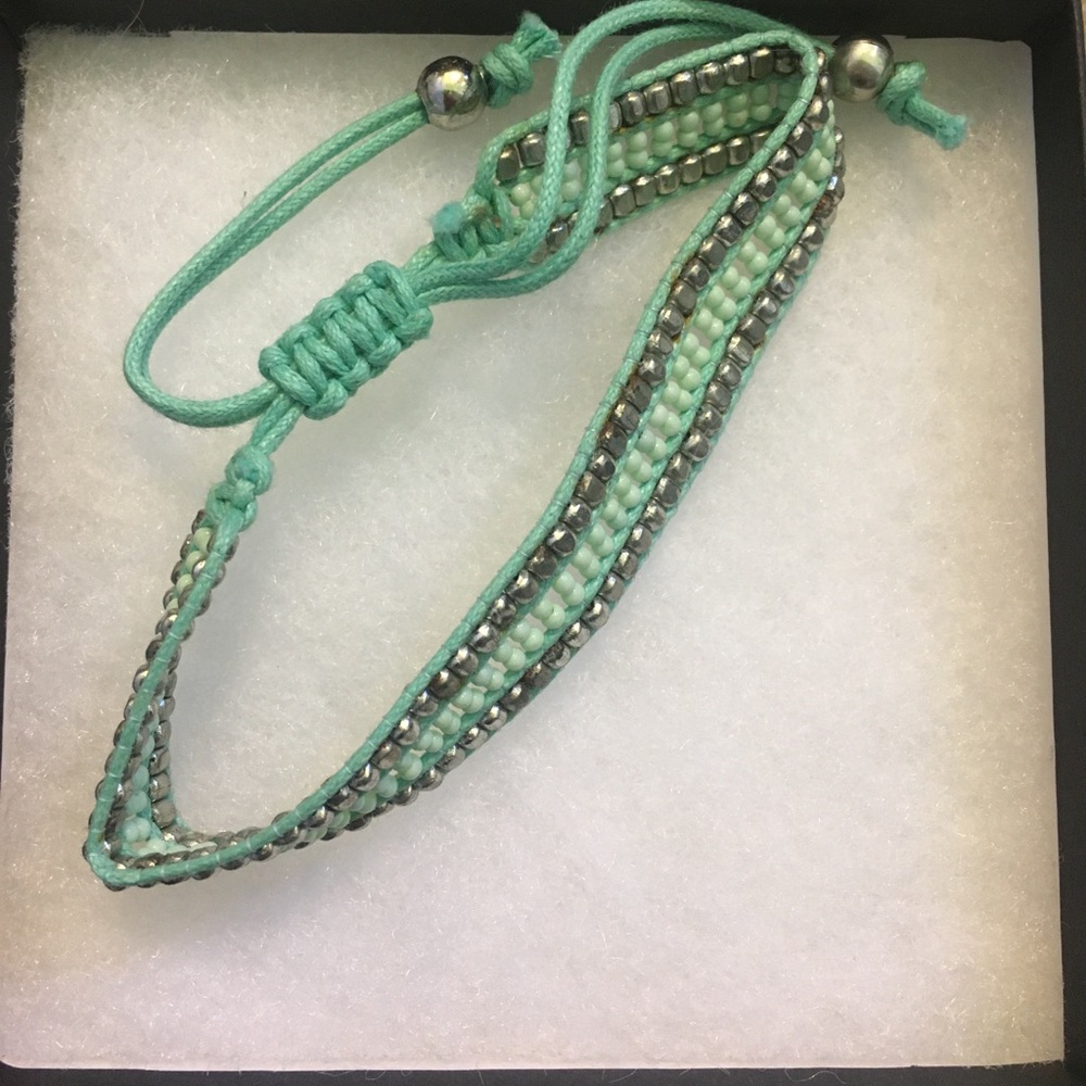 Silver and teal beaded bracket by Cow Harbour